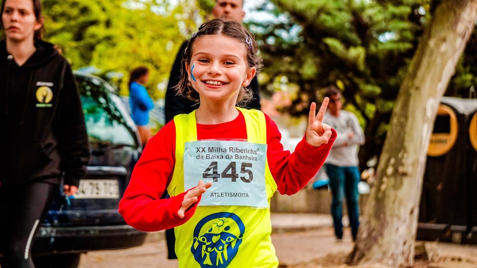 support young athletes without pressure - Young girl participating in a vibrant marathon event, showing enthusiasm and energy.