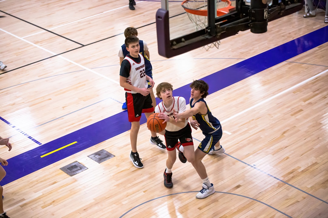 Basketball Shooting Form: 7 Steps to a Perfect Shot Every Time 2 basketball shooting form - a group of young men playing a game of basketball