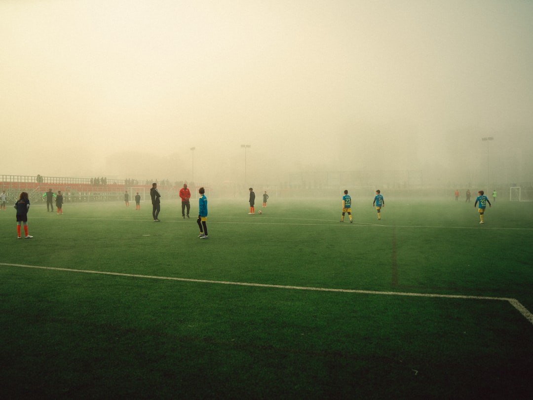 how to choose the right sport for your child - People playing soccer on a foggy field