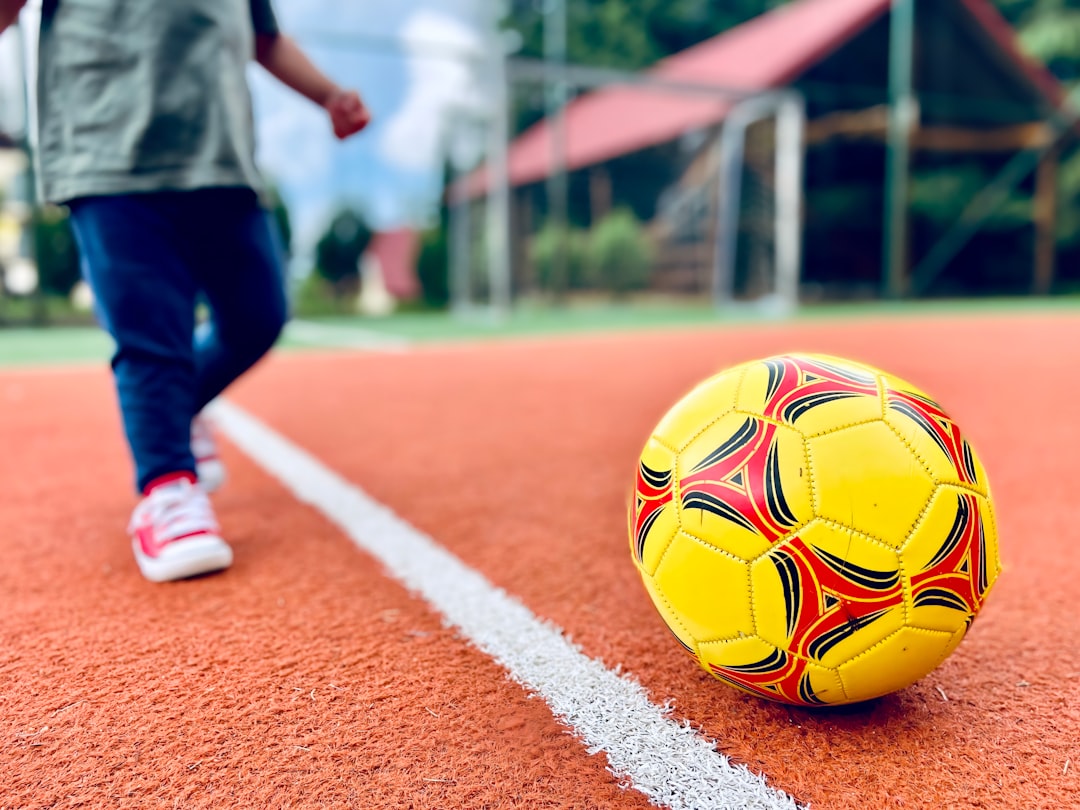 how to choose the right sport for your child - Child playing soccer on a field