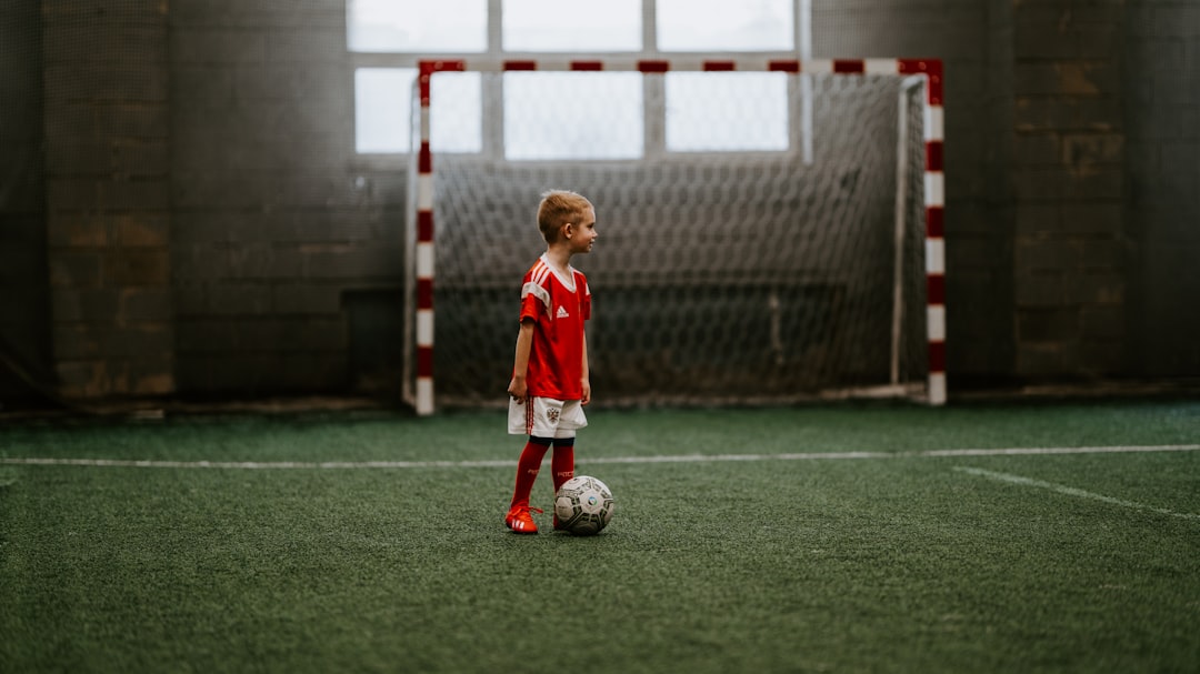 How to Discover What Sports Your Child Might Love 2 boy standing beside soccer ball near soccer net