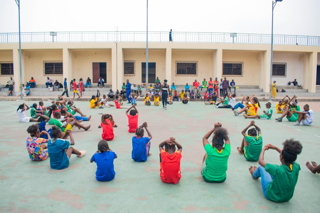 How to Run a Successful Youth Sports Tryout: 7 Essential Tips for Coaches 2 youth sports tryout - Children exercising in a circle outdoors