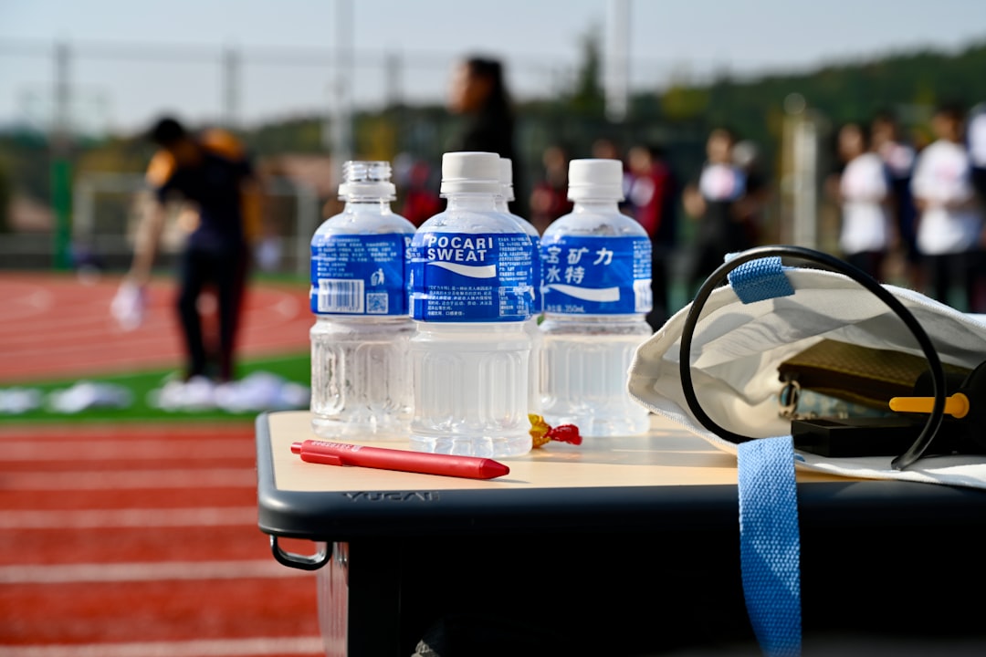sports nutrition for young athletes - a table with a helmet and bottles of water on it