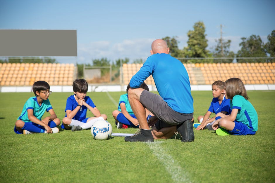 youth sports news May 2026 - Group of kids receiving soccer coaching on a sunny day at a soccer field in Portugal.