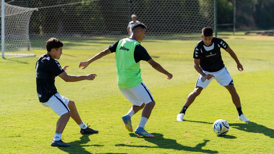 Special Olympics Kicks Off, World Cup Soccer Surge, Florida EKG Law, TeamSnap Hits $20M: 15 Must-Know Youth Athlete Development Stories (June 21, 2026) 1 youth athlete development - Three young men engage in soccer practice outdoors on a sunny day.
