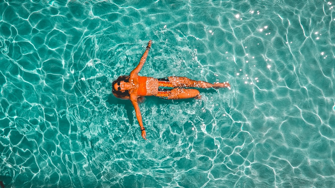Teaching a child to float on their back